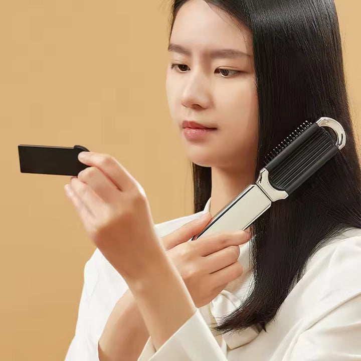 Compact hairbrush with integrated mirror |