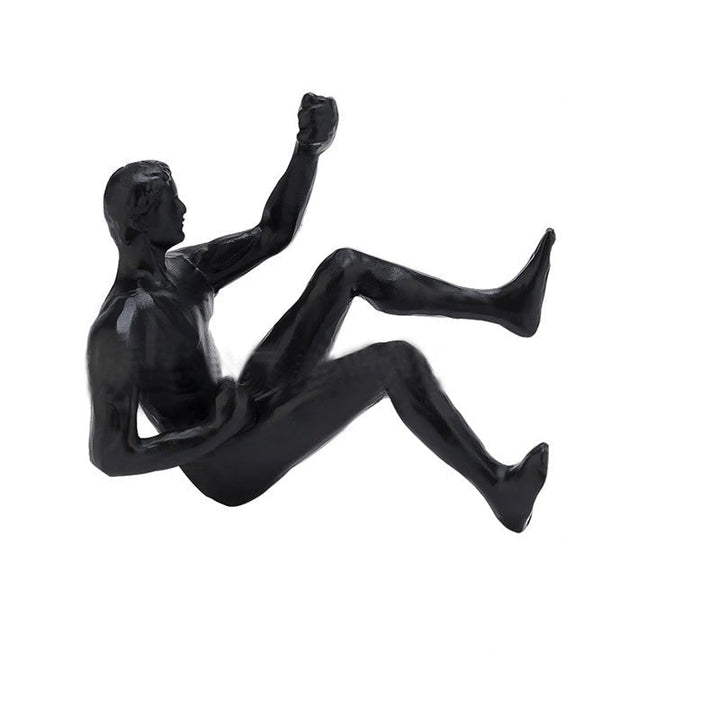 Climbing wall hanging statues