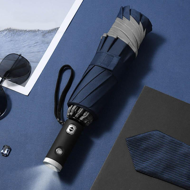 Automatic foldable umbrella with reflective edge