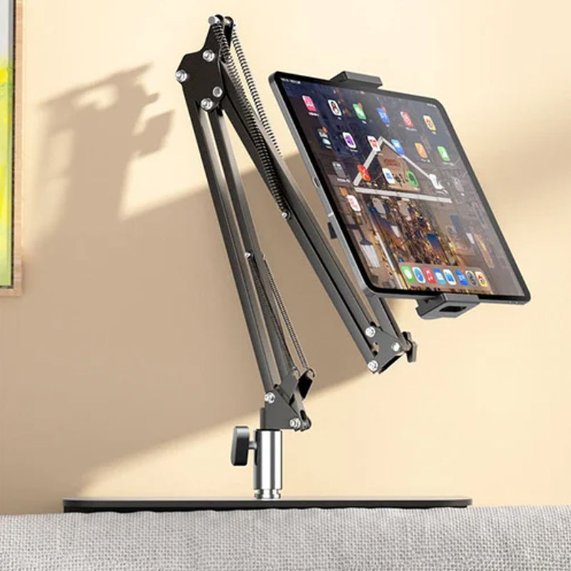 Extendable, concealed phone/tablet holder at the bed