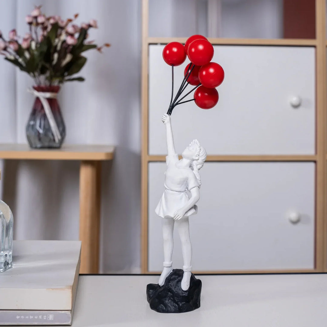 Sculpture of a girl with balloon in Banksy style for table decoration and creative living room decoration