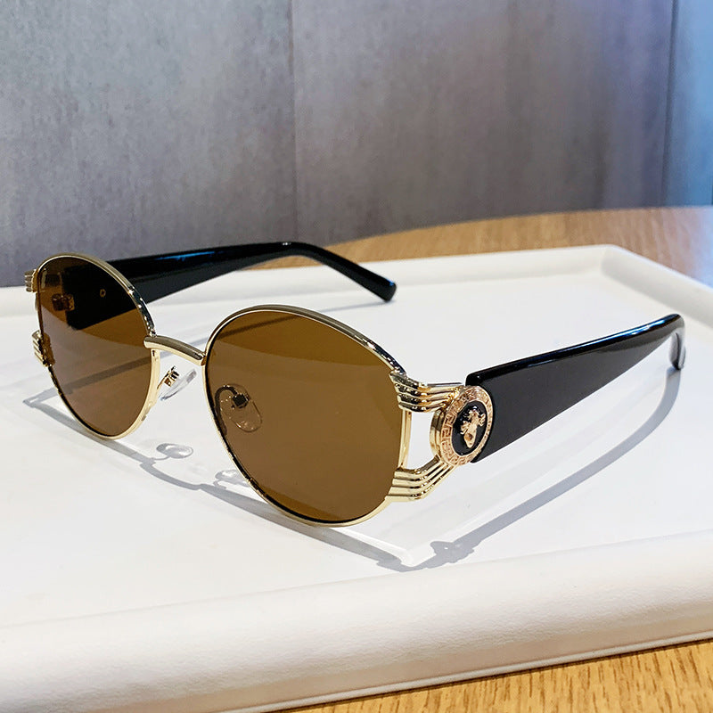 Ladies elegant sunglasses with luxurious metal frame and mirrored lenses