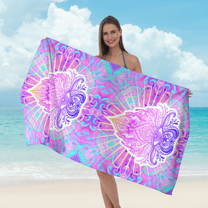 Beach towel with mirrored mandala design