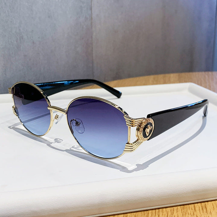 Ladies elegant sunglasses with luxurious metal frame and mirrored lenses