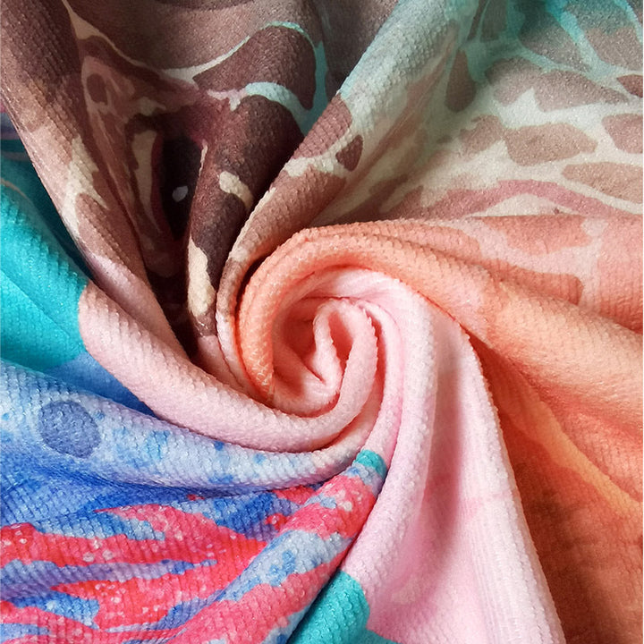 Beach towel with mirrored mandala design