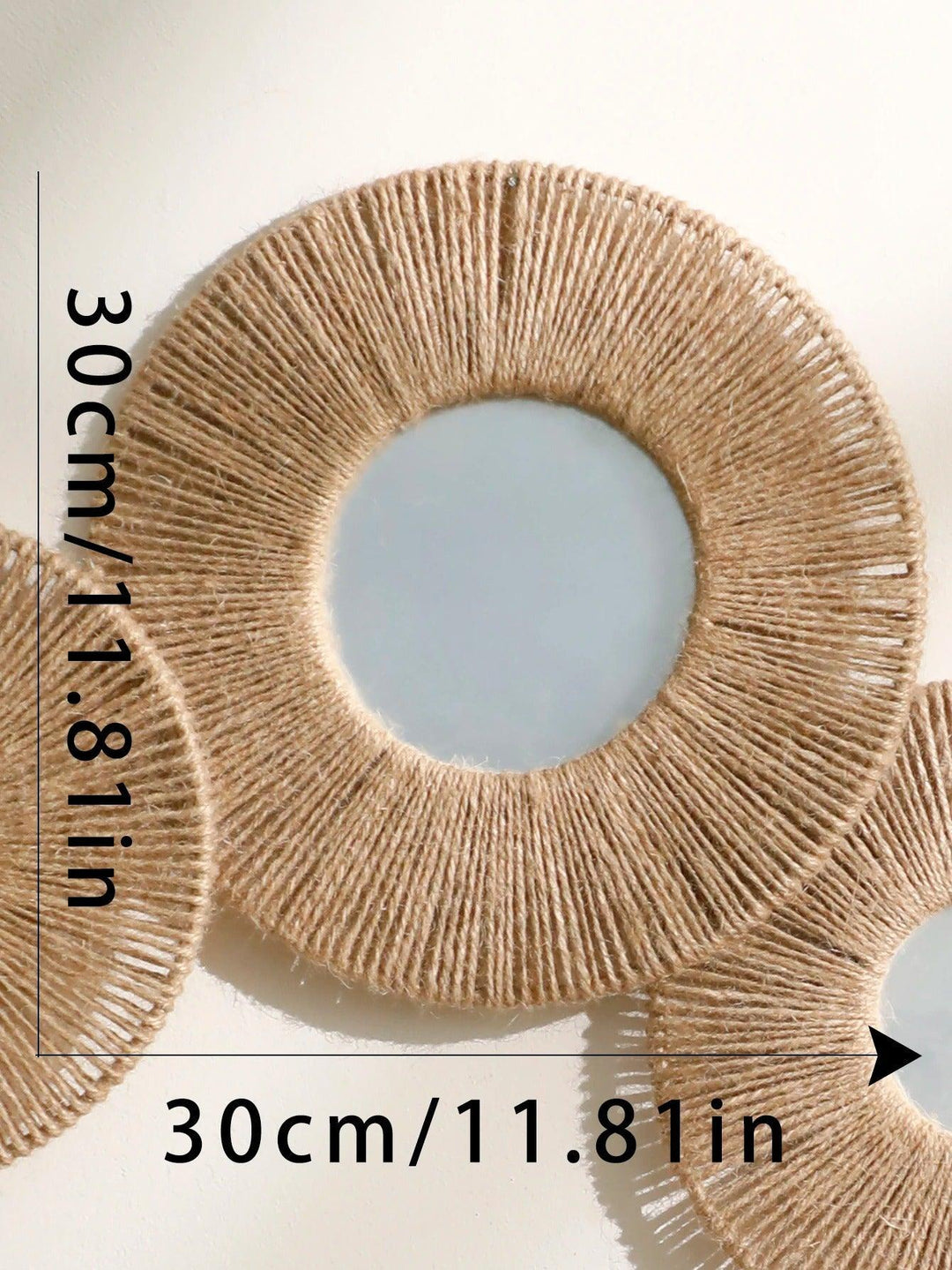 Round decorative wall mirror in boho style with woven hemp rope