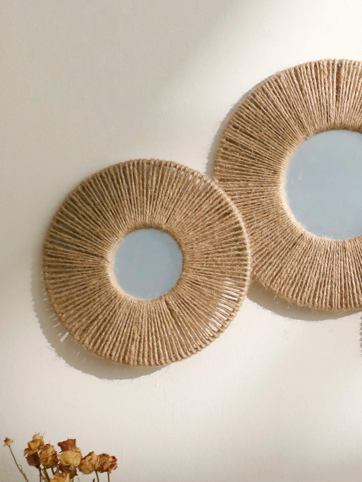 Round decorative wall mirror in boho style with woven hemp rope
