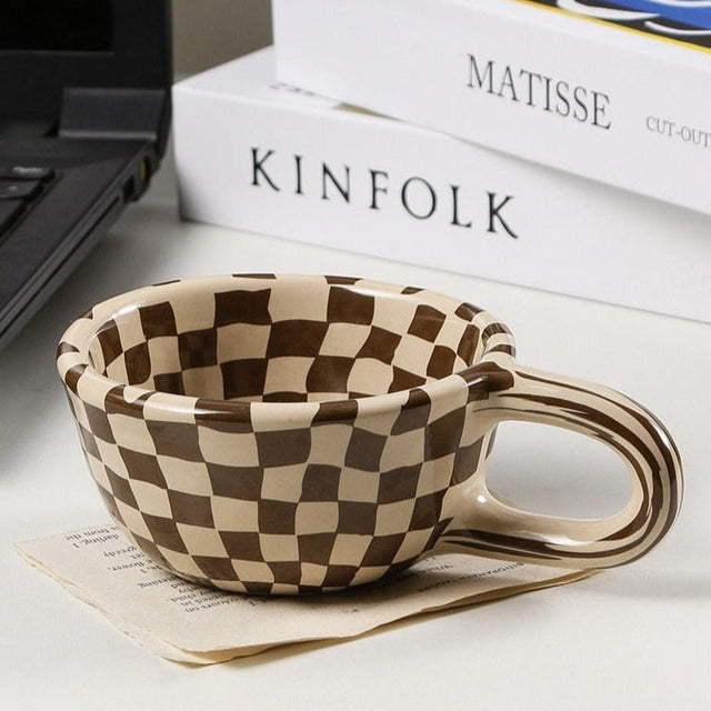 Ceramic mug with irregular checkerboard pattern