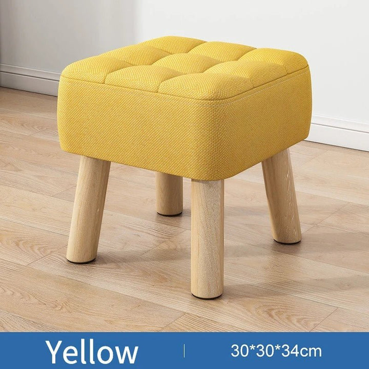Padded ottoman stool in retro style in pastel colours
