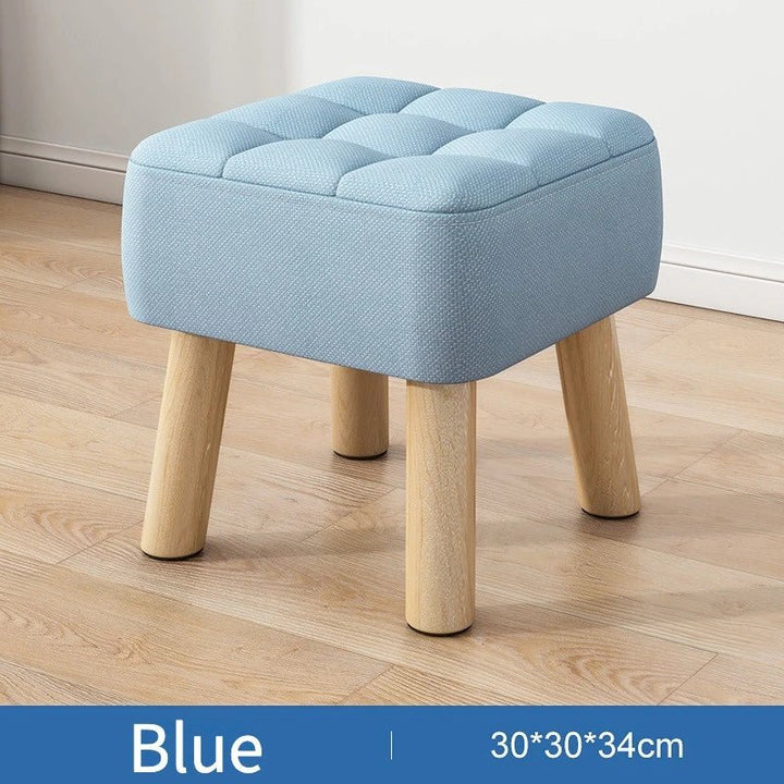 Padded ottoman stool in retro style in pastel colours